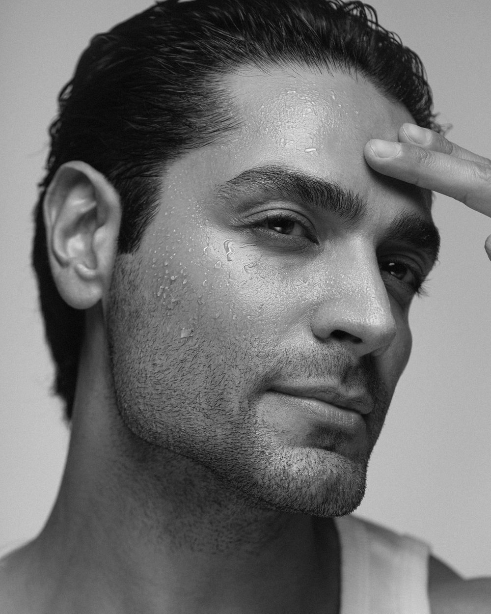 Three-quarter male portrait — upper-third facial treatments